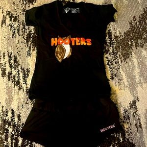 Short sleeve hooters black uniform. Only worn once. Small shirt. Medium shorts.